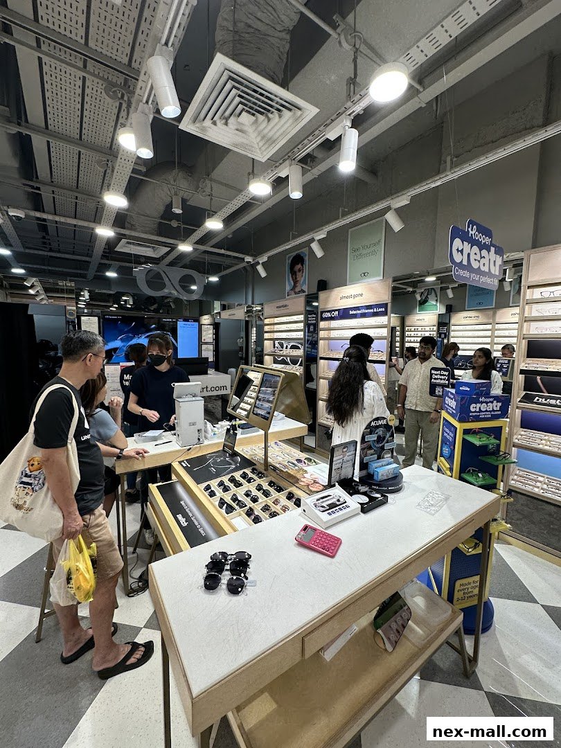 Customers browsing eyewear and accessories inside a Lenskart NEX store.