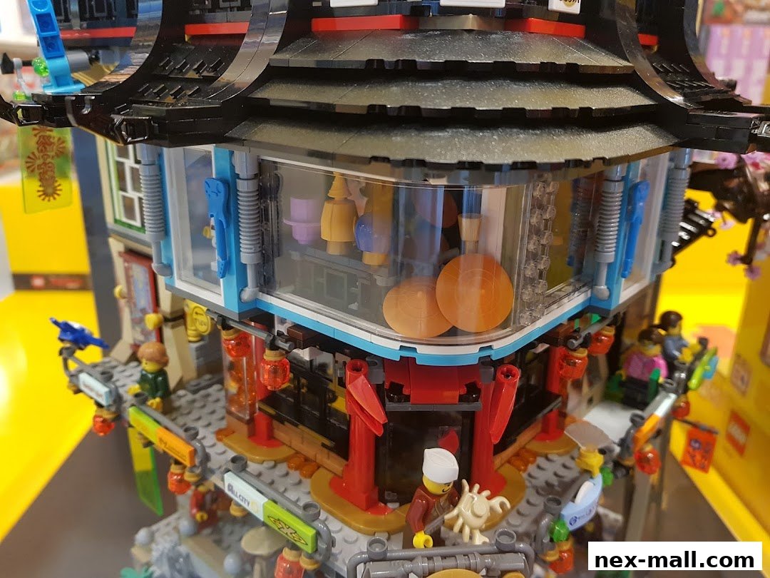 Detailed view of a LEGO Ninjago-themed building with minifigures and intricate details.