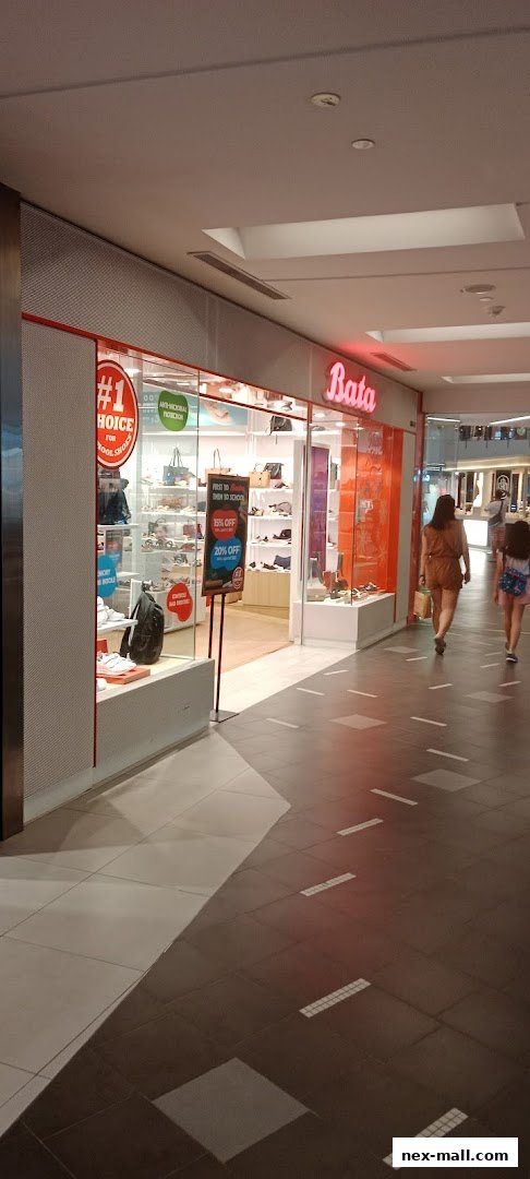 The Bata shoe store entrance with displays of shoes and bags, and promotional signage.