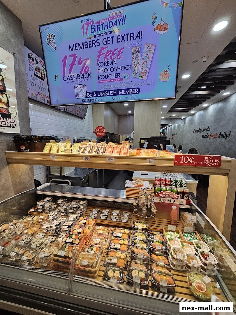 A display of pre-packaged sushi and drinks inside a Japanese restaurant.