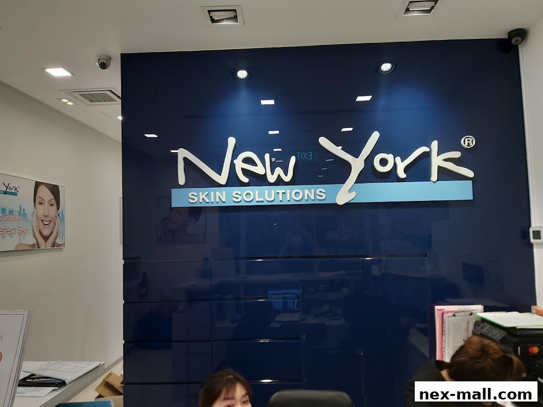The interior reception area of New York Skin Solutions, featuring their prominent logo and a promotional poster.