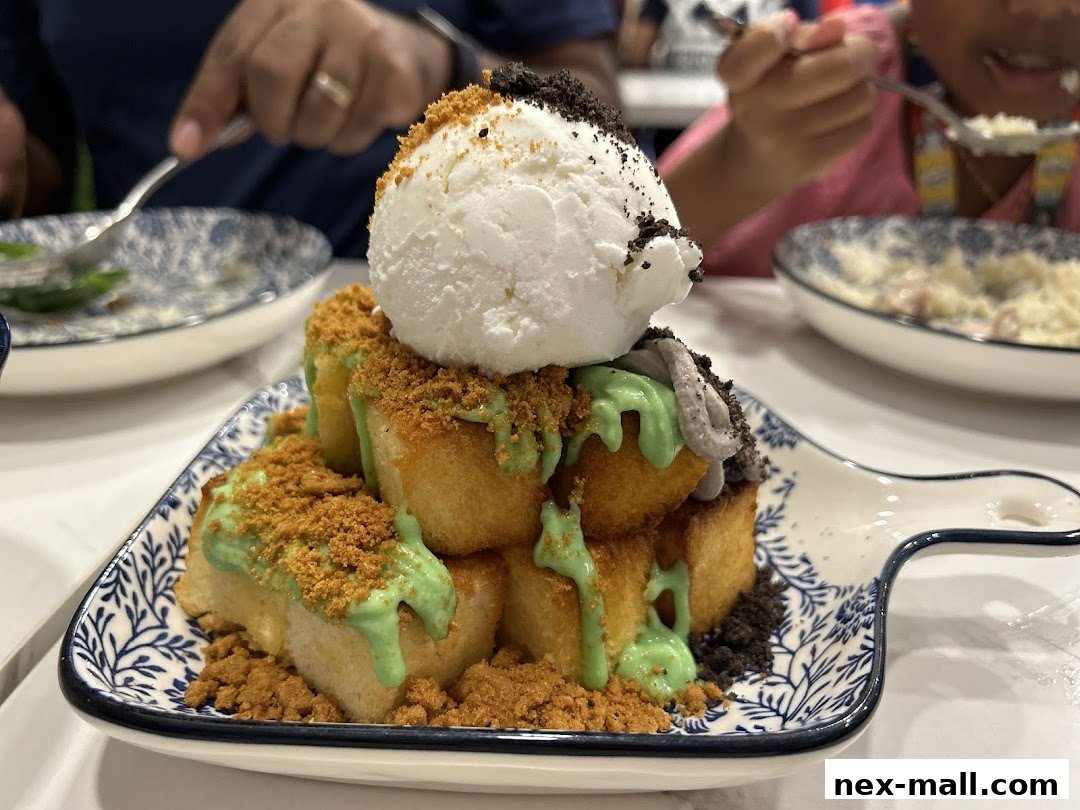 A delicious dessert with ice cream, toast, and cookie crumbs served on a decorative plate.