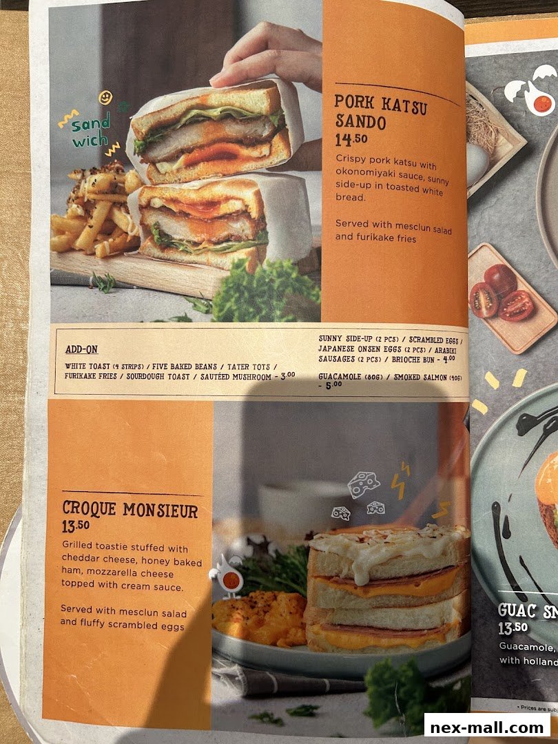 A menu page featuring delicious sandwiches like Pork Katsu Sando and Croque Monsieur.