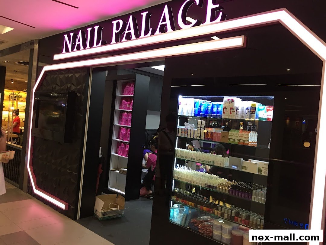 The exterior of Nail Palace, showcasing its illuminated signage and display shelves with nail products.