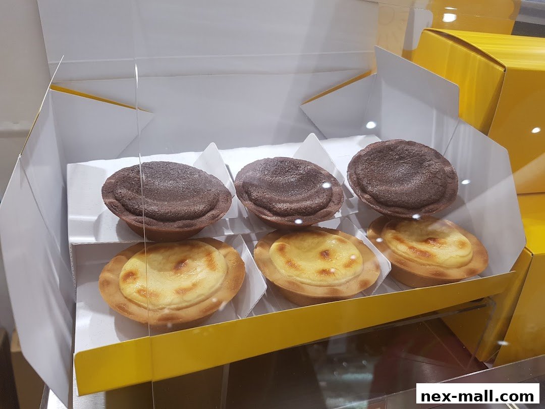 A display box filled with chocolate and cheese tarts from Châteraisé.