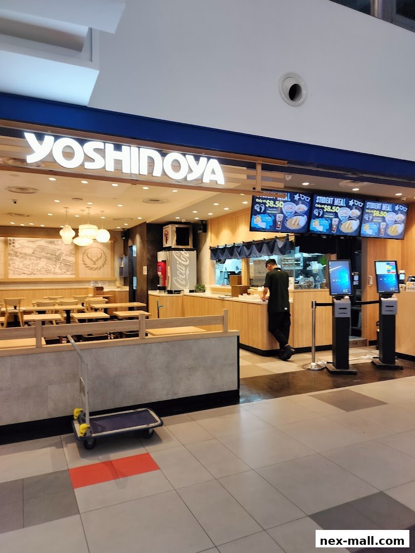 The Yoshinoya restaurant entrance with digital menus displaying student meal deals.