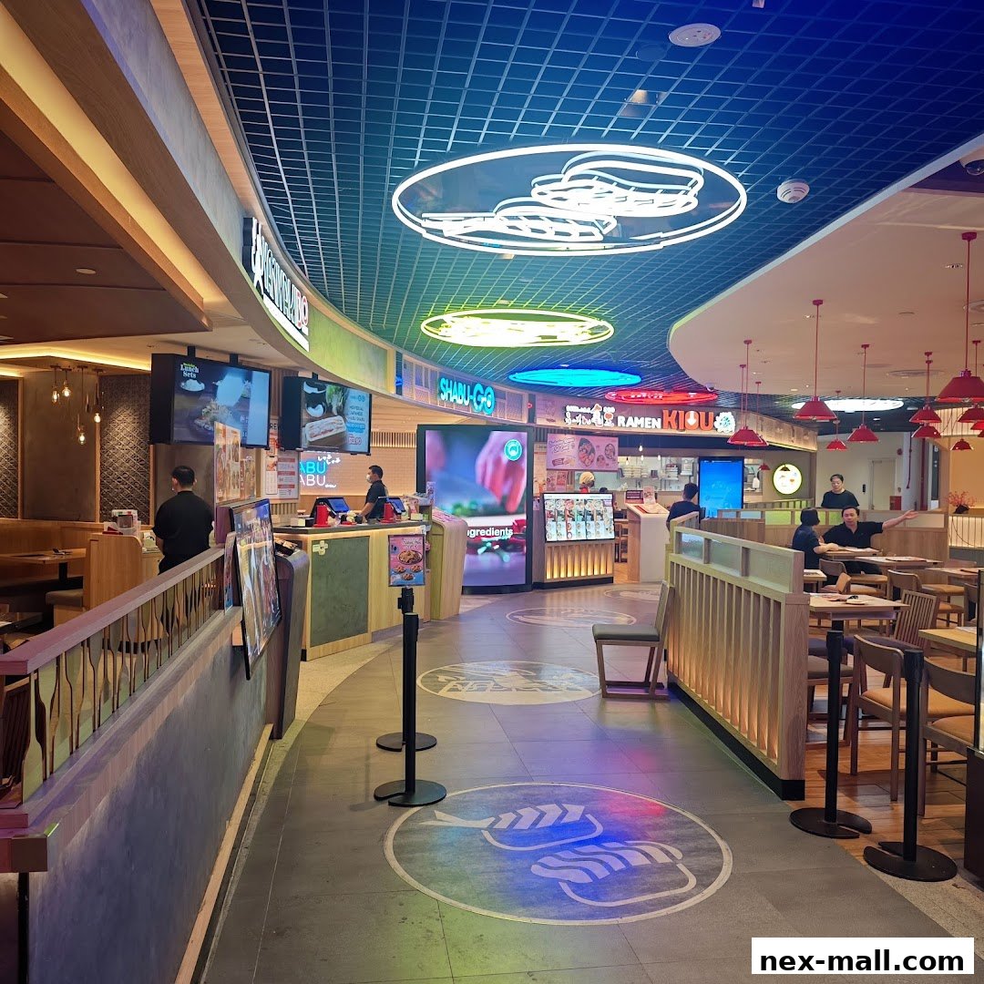 A vibrant food court with various Japanese restaurants and neon signage.