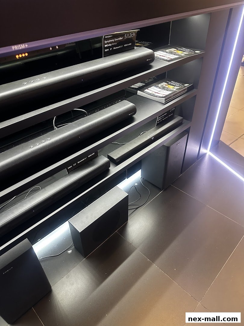A display of various soundbars and subwoofers from PRISM+.
