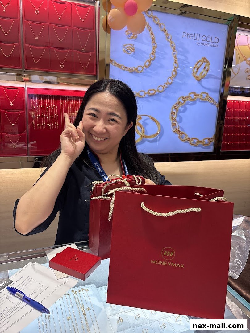 A smiling woman poses with shopping bags and jewelry displays at MoneyMax Pawnshop.