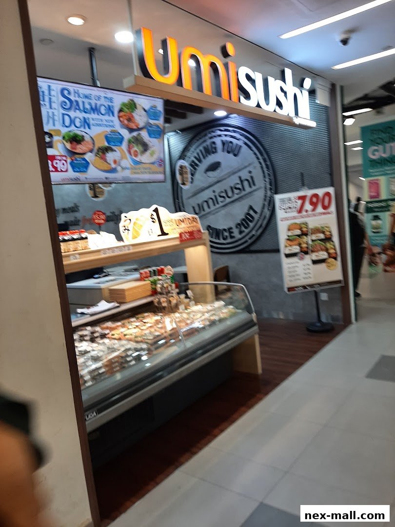 The exterior of a sushi shop with a display case full of sushi and promotional signs.