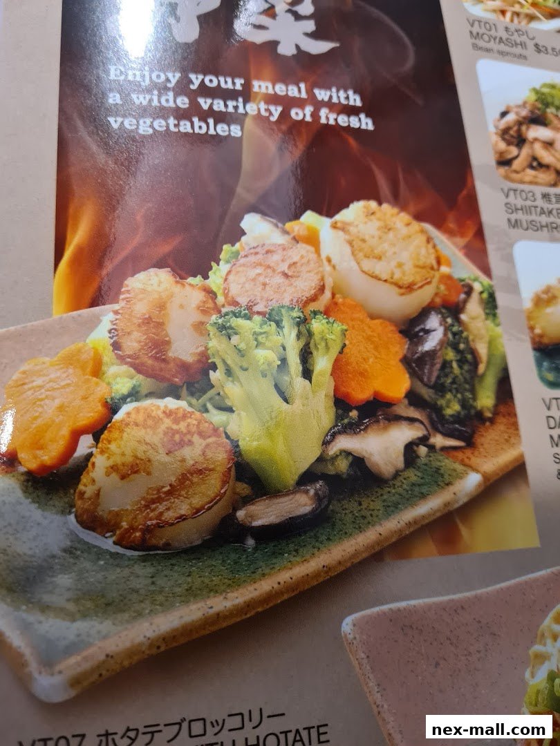 A close-up of a menu featuring a dish with scallops, broccoli, carrots, and mushrooms.