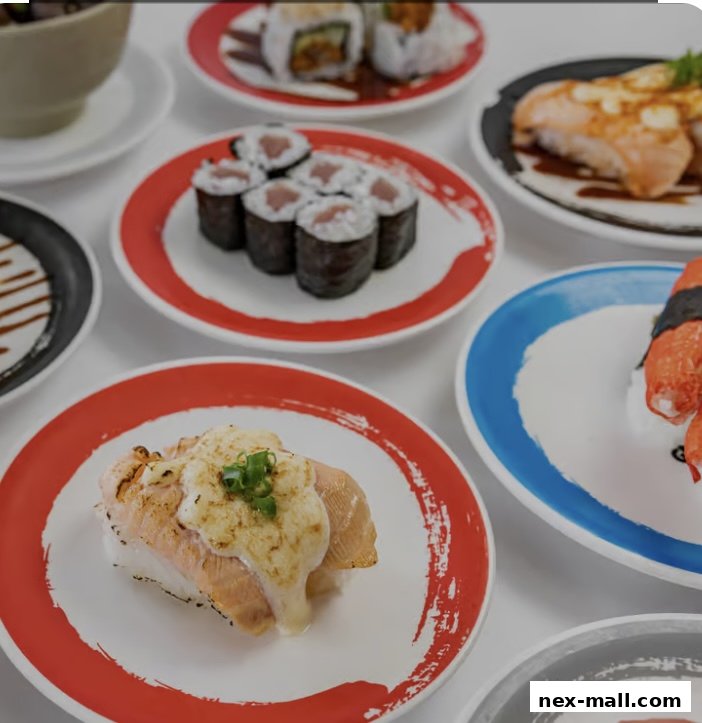 A variety of sushi dishes served on colorful plates, including salmon and tuna rolls.