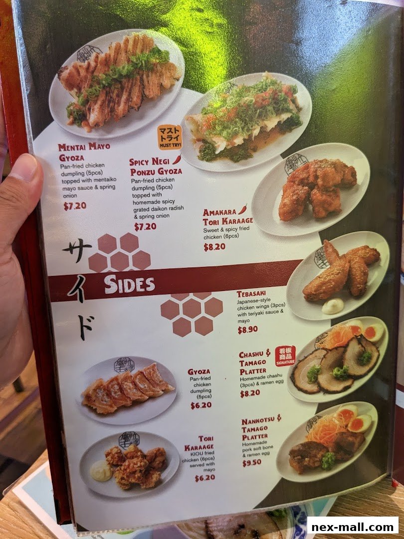 A menu page showcasing various Japanese side dishes like gyoza, karaage, and platters.