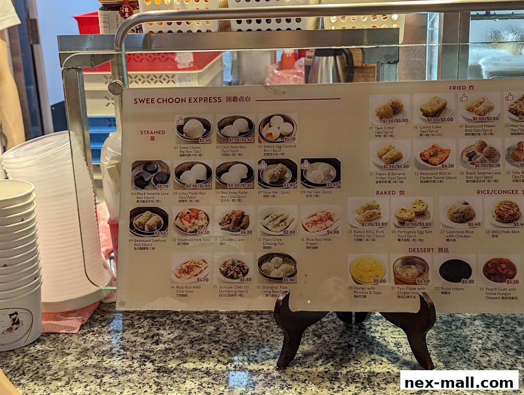 A menu board for Swee Choon Express, featuring steamed, fried, baked, rice/congee, and dessert items.