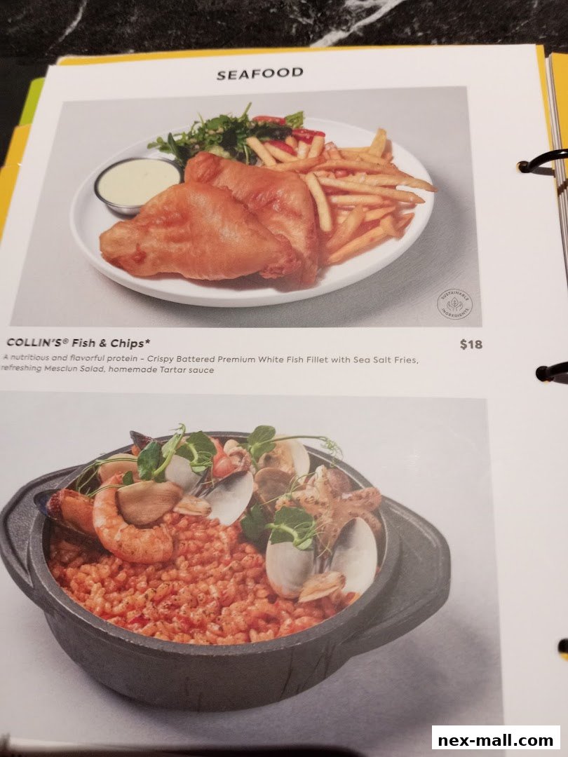 A menu page featuring seafood dishes, including fish and chips and a seafood risotto.