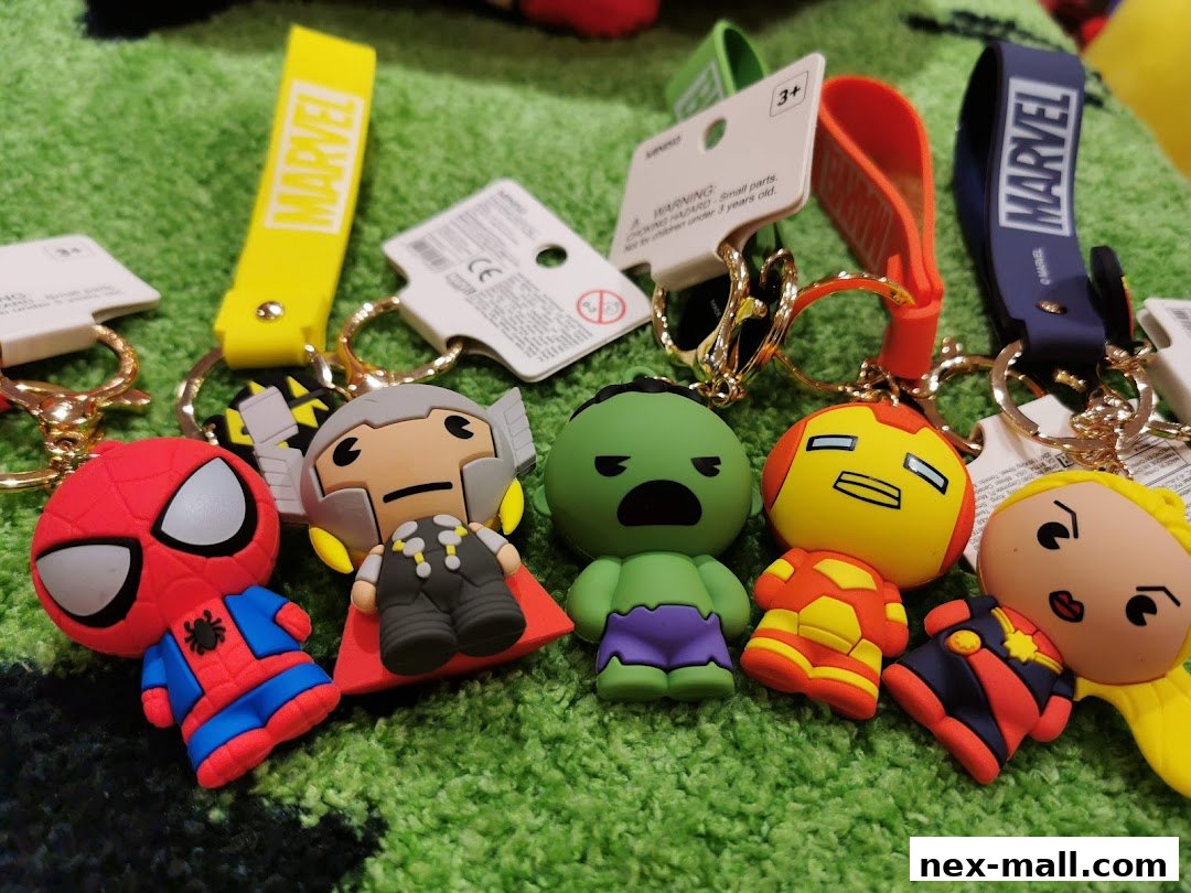 A collection of Marvel character keychains, including Spider-Man, Thor, Hulk, Iron Man, and Captain Marvel.