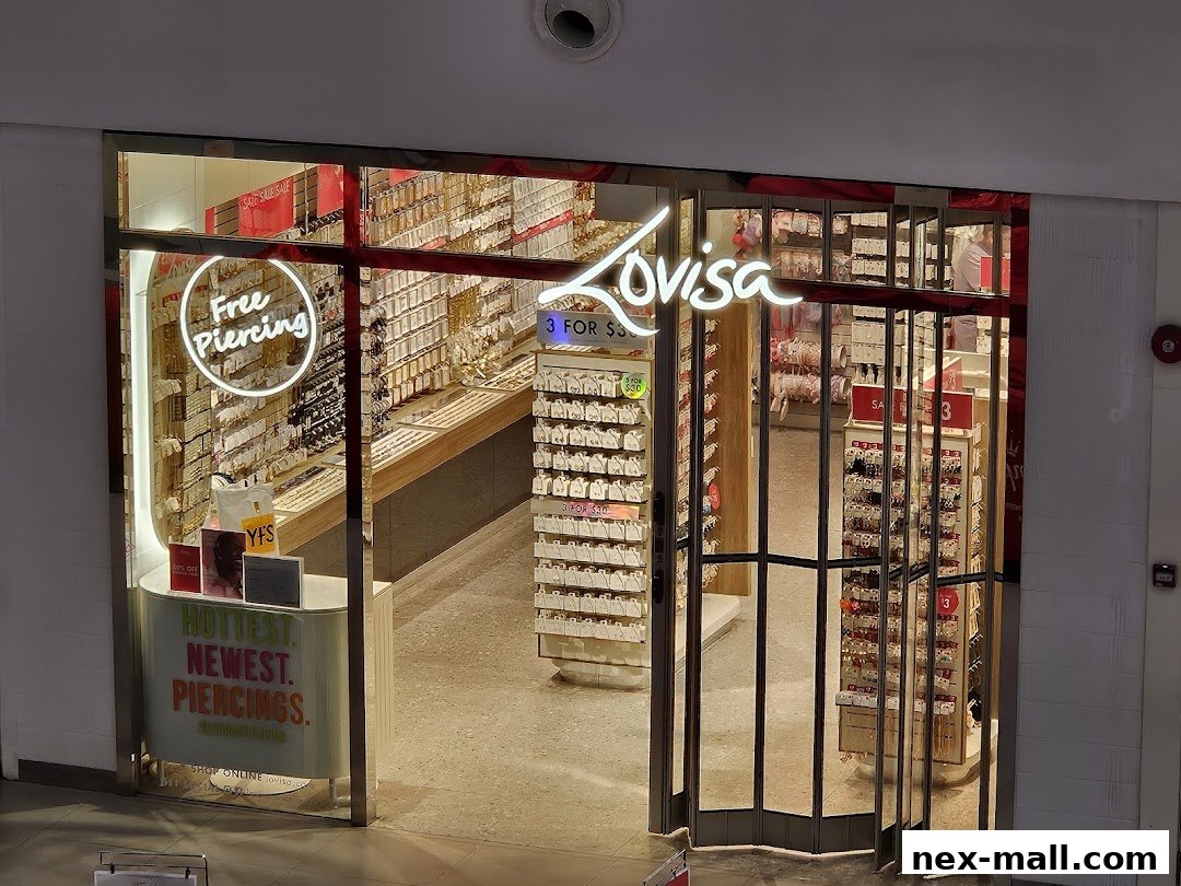 The entrance of Lovisa, a jewelry store, showcasing various earrings and offering free piercing services.