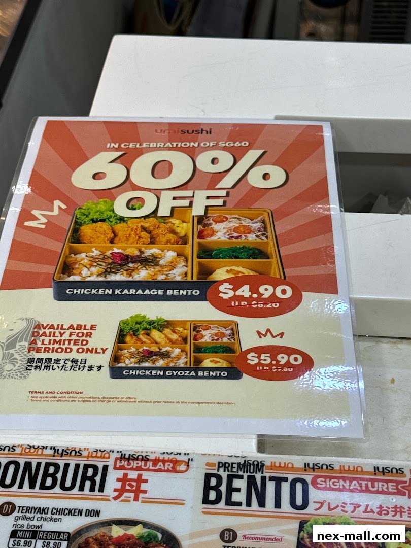 A promotional flyer for umisushi offering 60% off on bento boxes, featuring Chicken Karaage and Chicken Gyoza Bento.