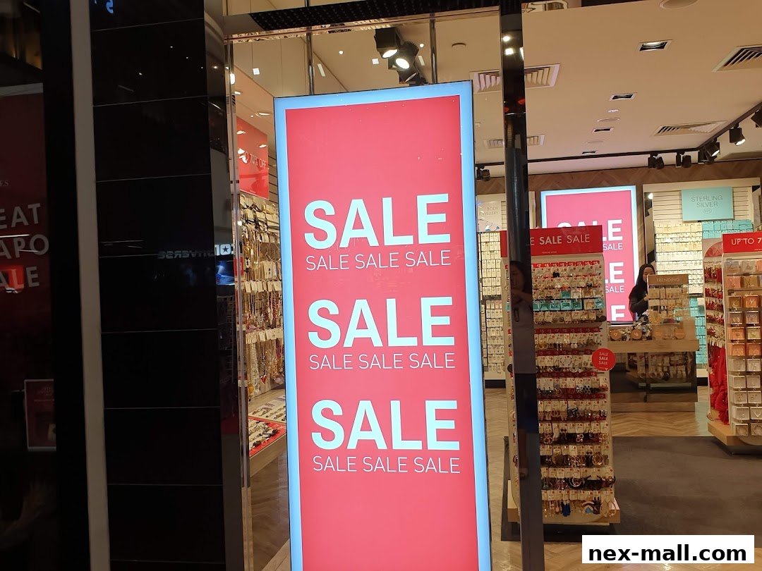 A shop window displaying a large red sign with the word SALE repeated multiple times.