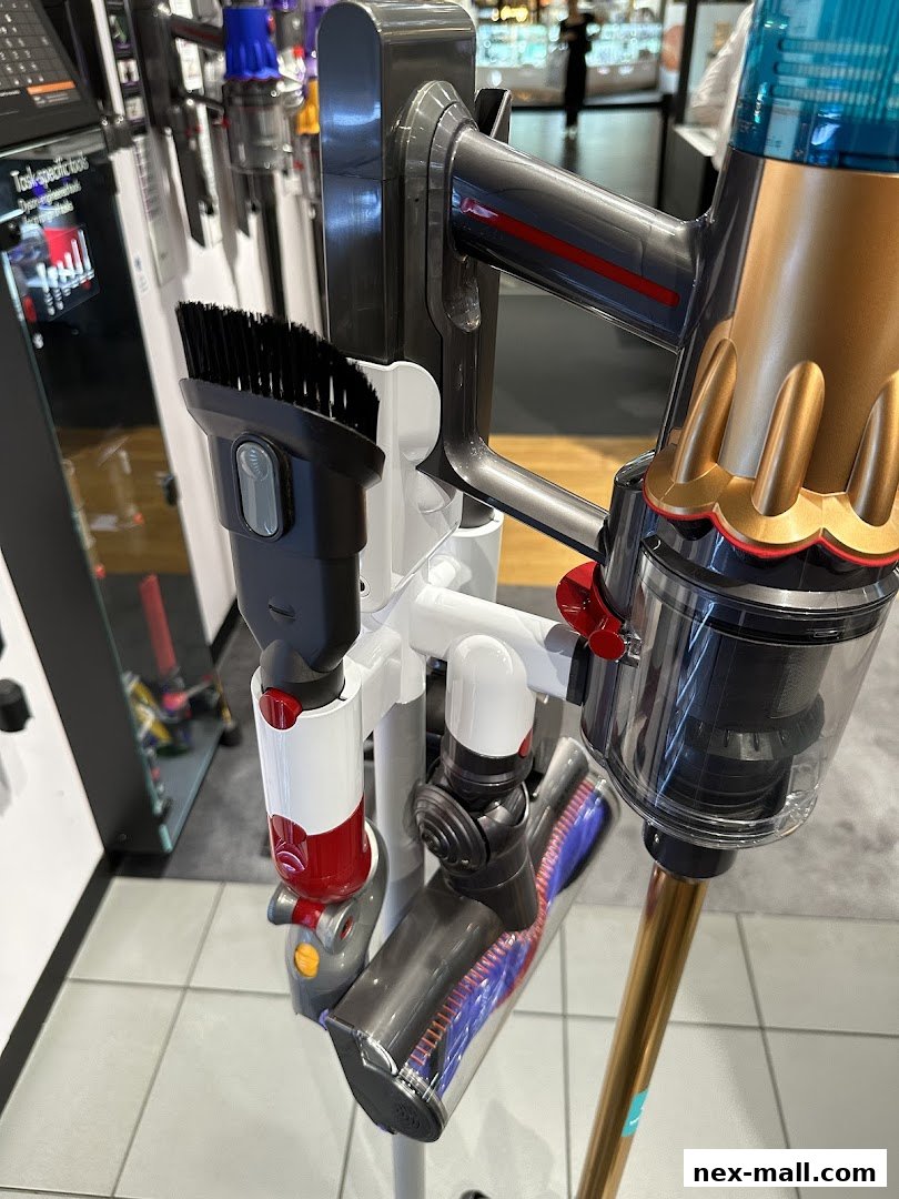 Close-up of a Dyson vacuum cleaner with various attachments displayed.