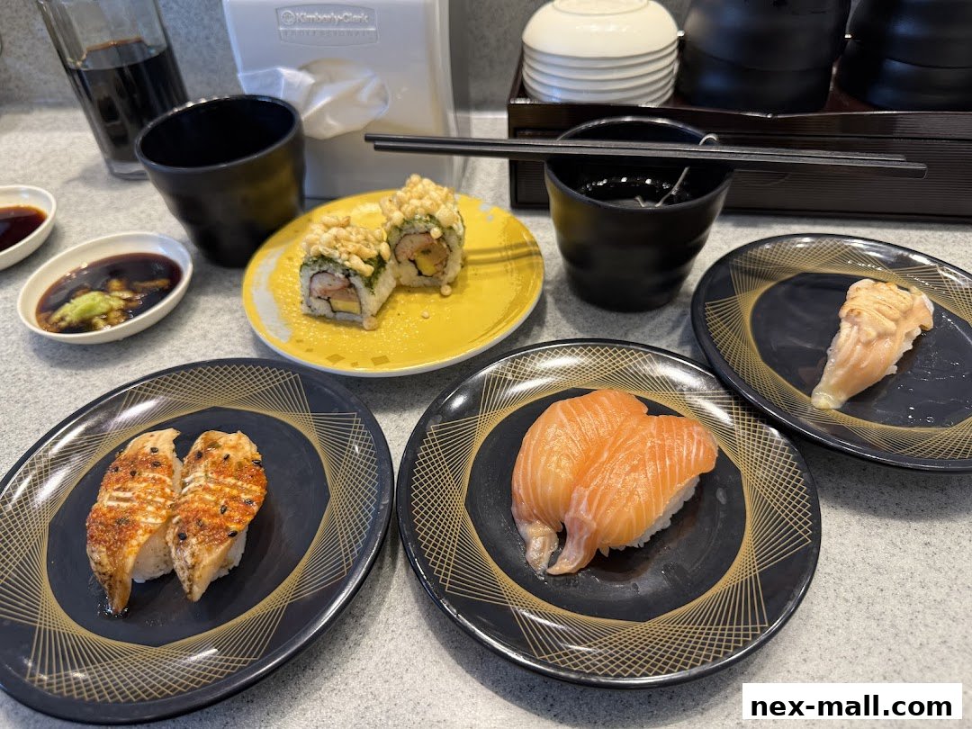 Plates of sushi and accompaniments arranged on a table at Sushi Express.