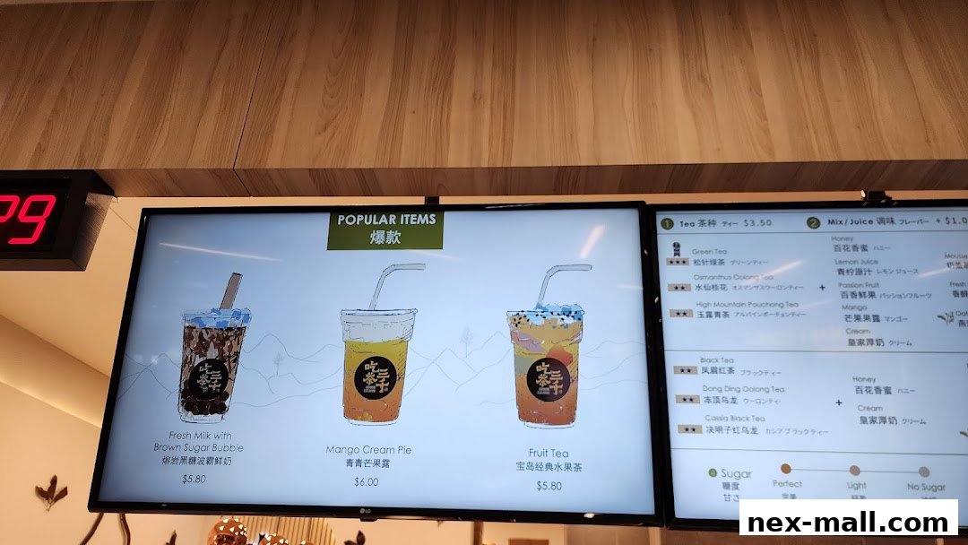 A digital menu displaying popular bubble tea drinks with illustrations and prices.