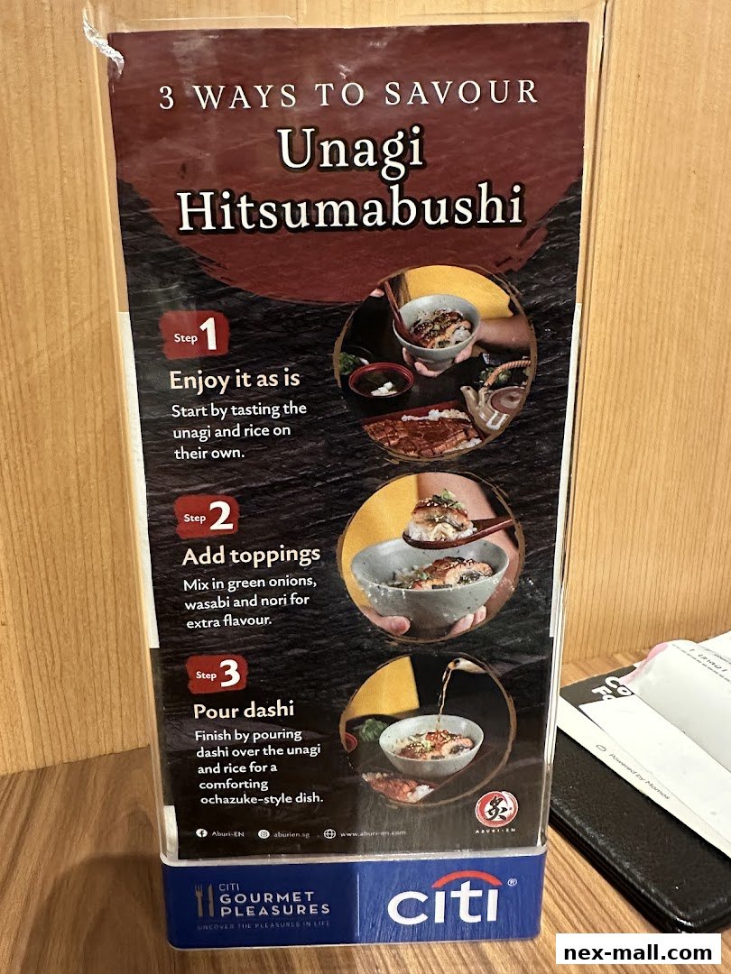 A sign detailing three ways to enjoy Unagi Hitsumabushi at Aburi-EN.