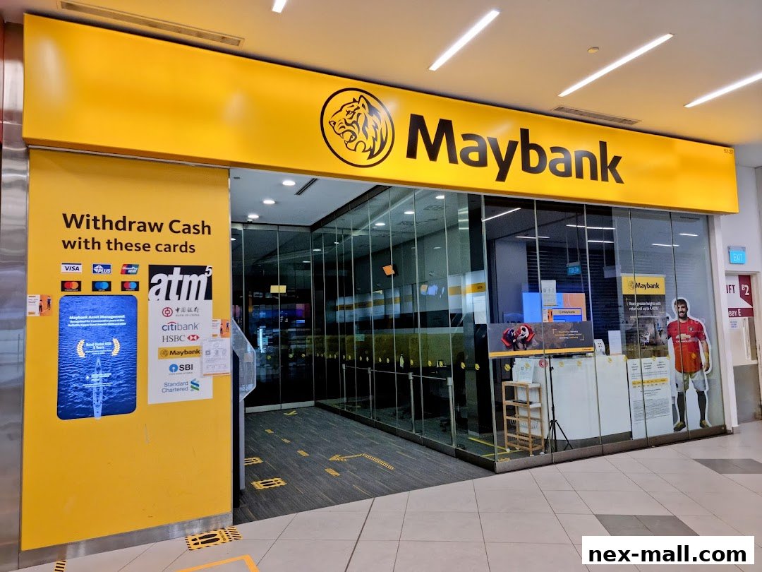 The exterior of a Maybank branch with an ATM and promotional displays.