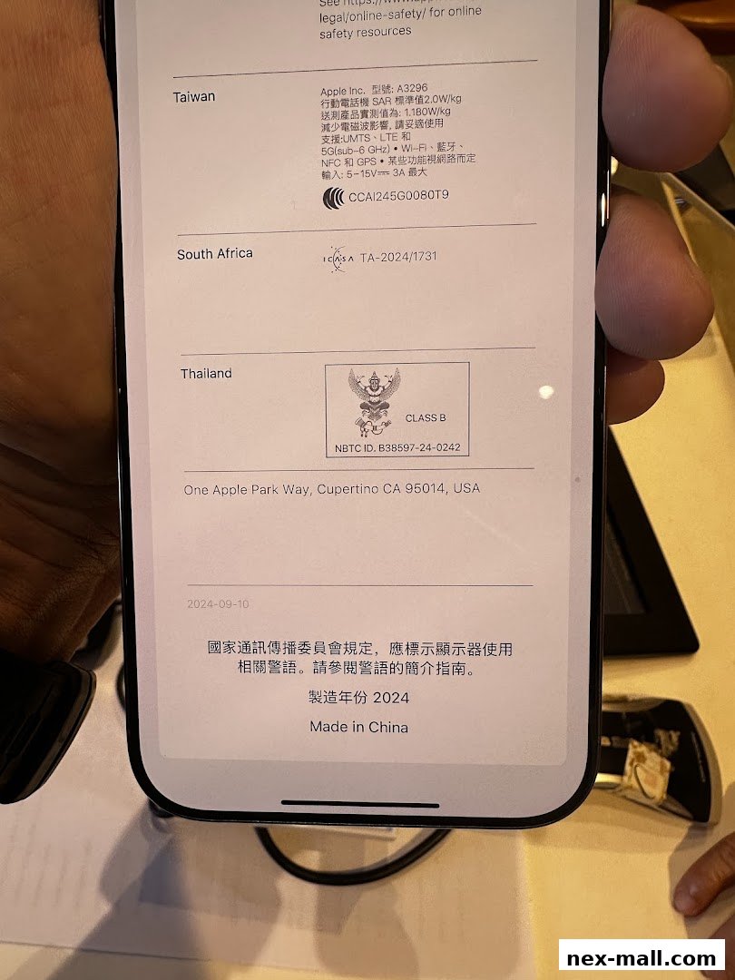 Close-up of a phone screen displaying regulatory information for various countries.