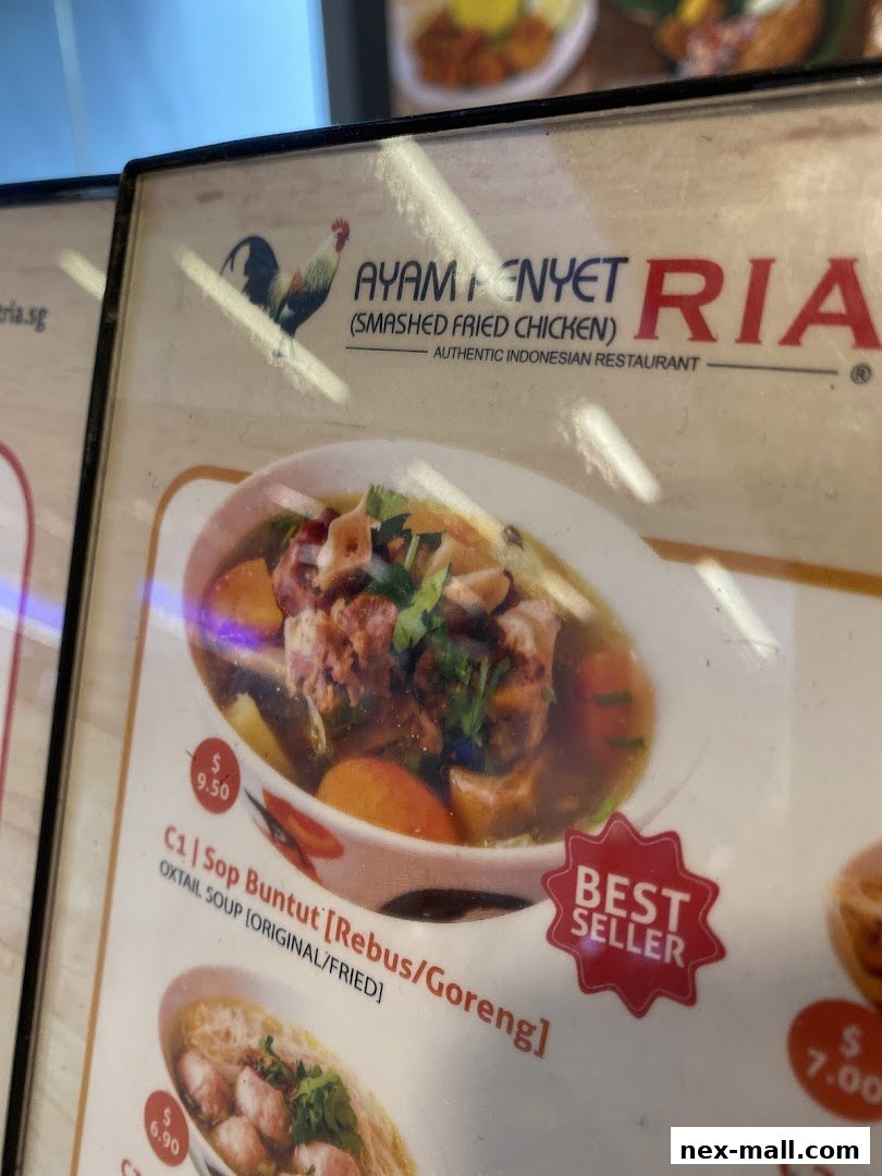A menu from Ayam Penyet Ria featuring Oxtail Soup and other Indonesian dishes.