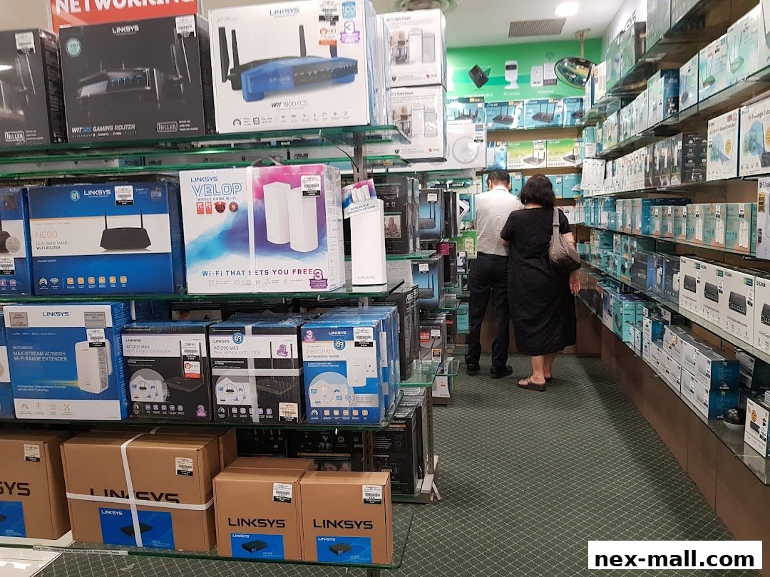 Interior view of a Challenger NEX electronics store showcasing networking equipment.