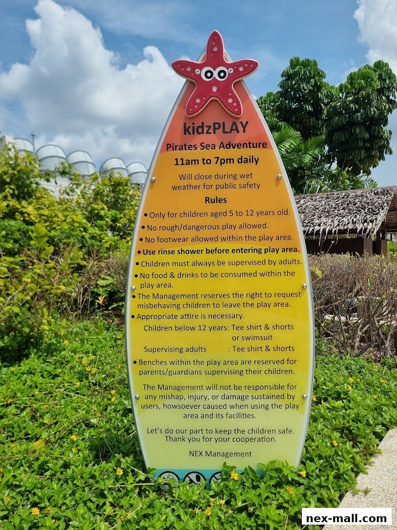 A sign for Kidzplay Pirates Sea Adventure with operating hours and rules.