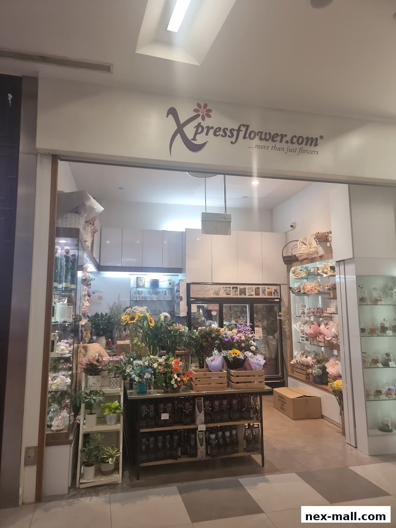 A flower shop with a vibrant display of fresh flowers and plants, showcasing bouquets and arrangements.
