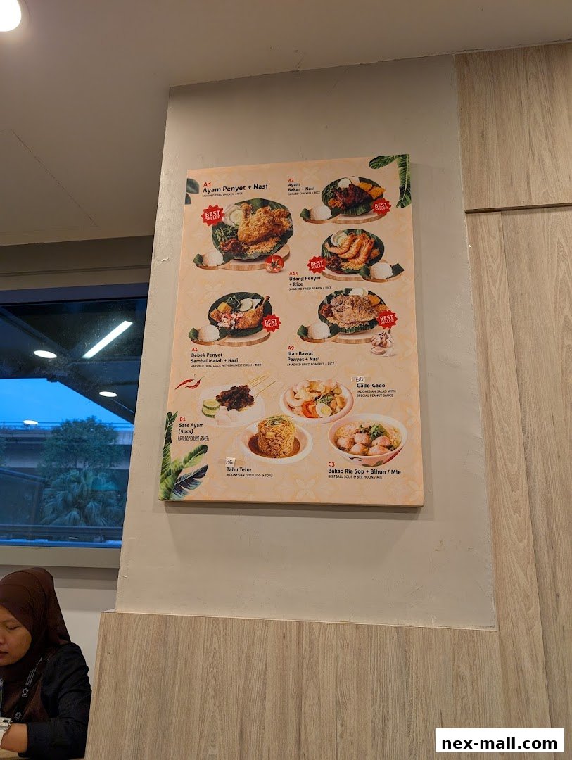 A menu board displaying various Indonesian dishes with images and descriptions.
