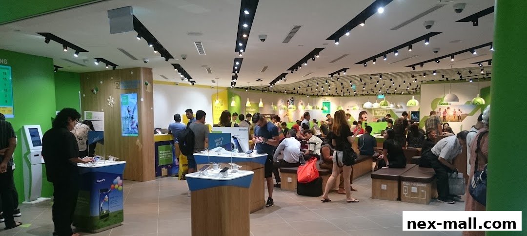 Interior view of a busy StarHub store with customers browsing products and services.