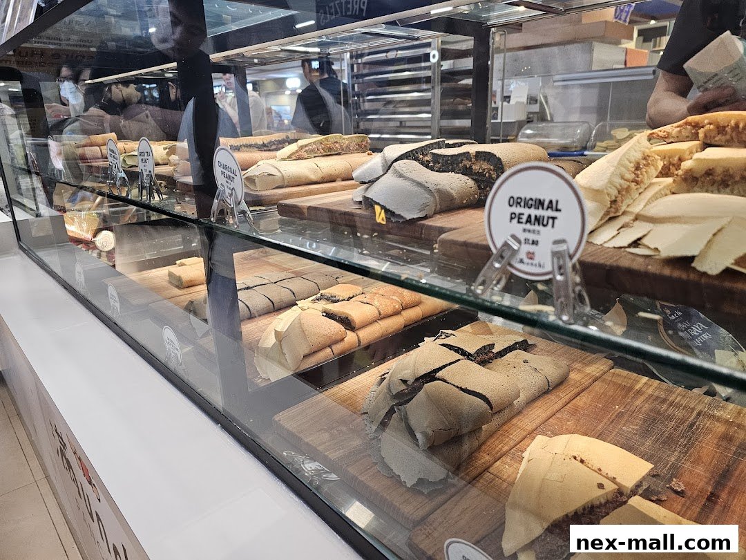 A display case filled with various flavors of pancakes, showcasing their delicious fillings.