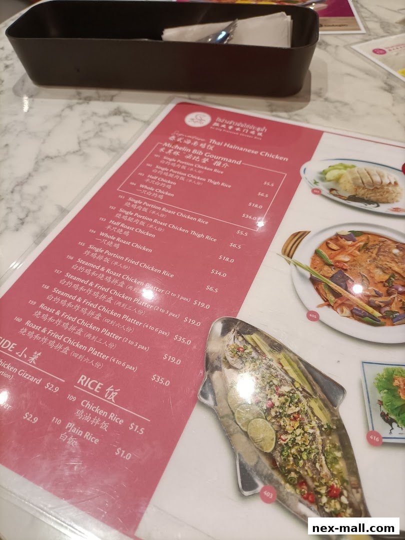 A menu from Go-Ang Pratunam Chicken Rice featuring various chicken rice dishes and platters.