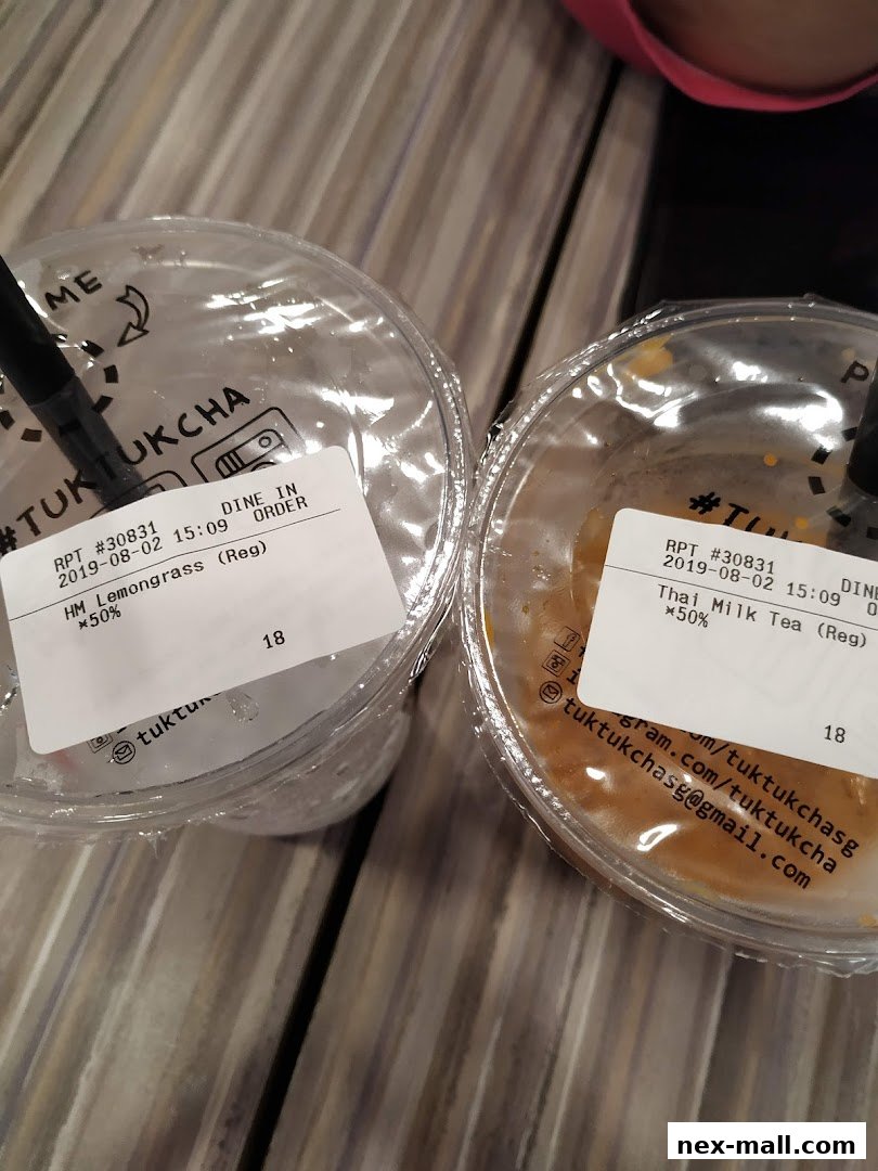 Two takeaway drinks from Tuk Tuk Cha, one Lemongrass and one Thai Milk Tea.