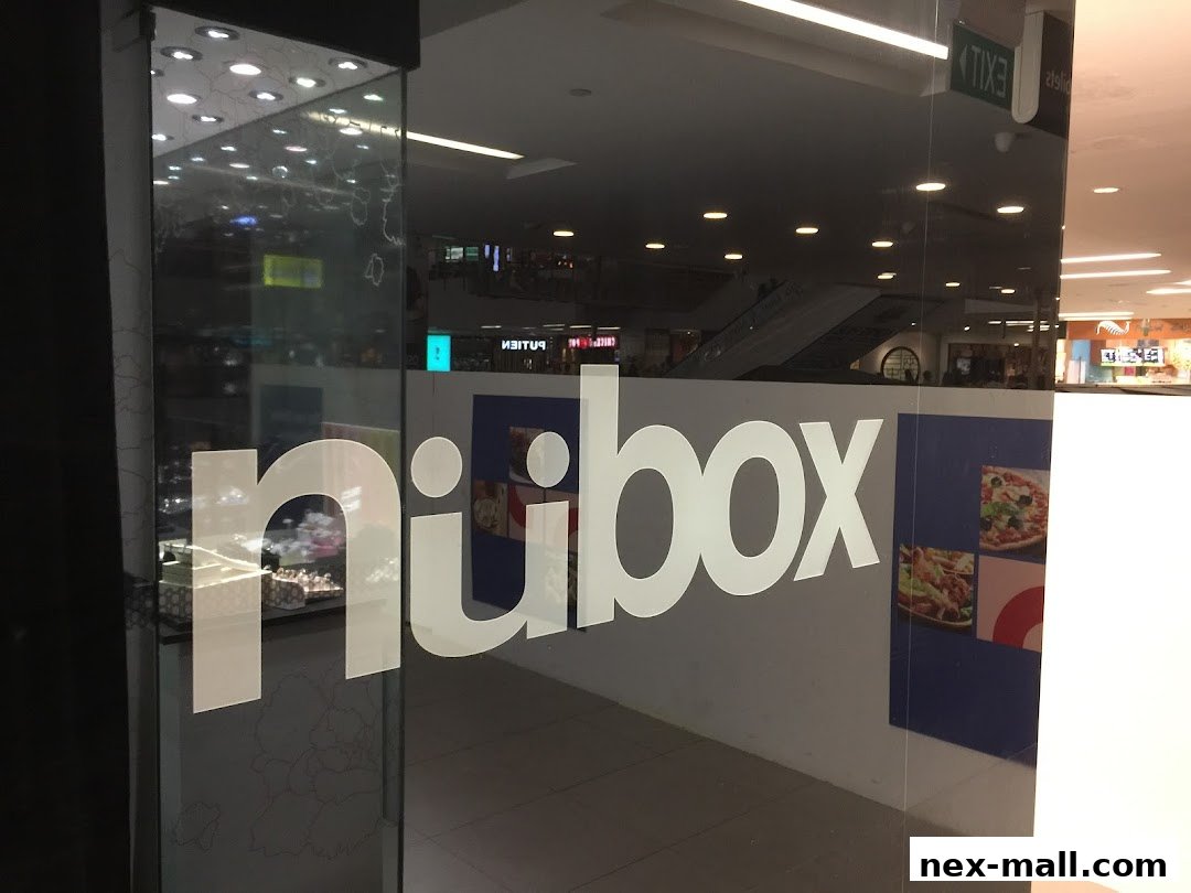 The entrance to a shop with the logo 'nubox' displayed on the glass door.
