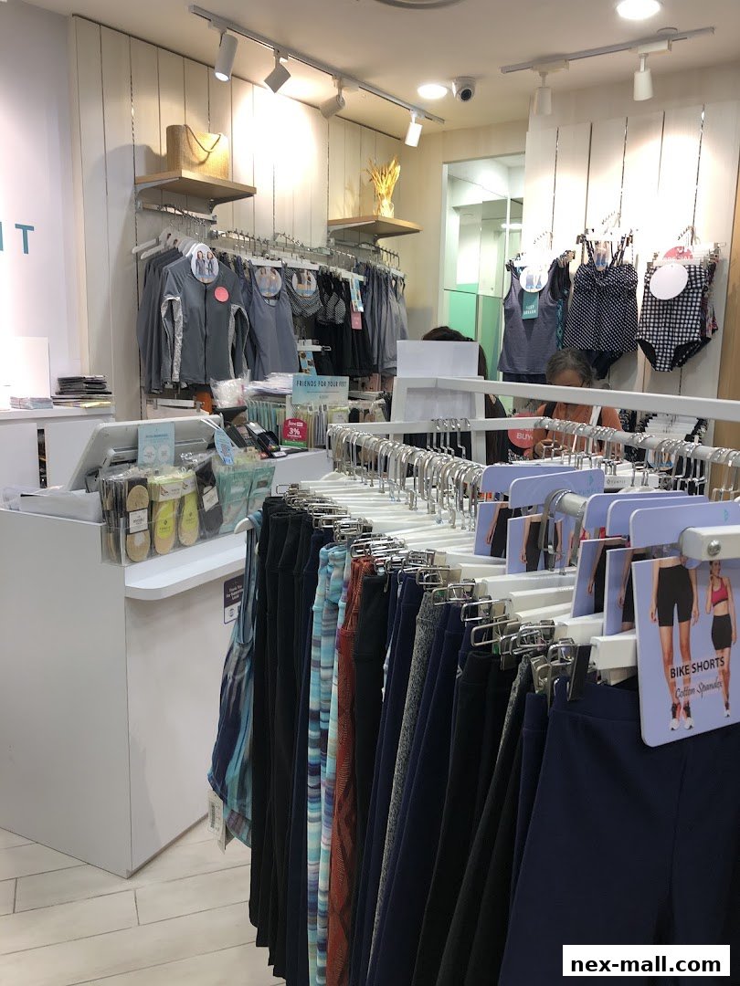 Interior view of a FUNFIT store showcasing activewear and accessories on display racks.