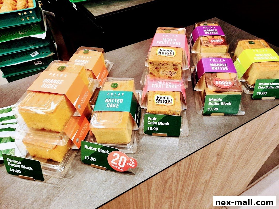 A display of various Polar Puffs & Cakes, including orange sugee, butter cake, and fruit cake blocks.