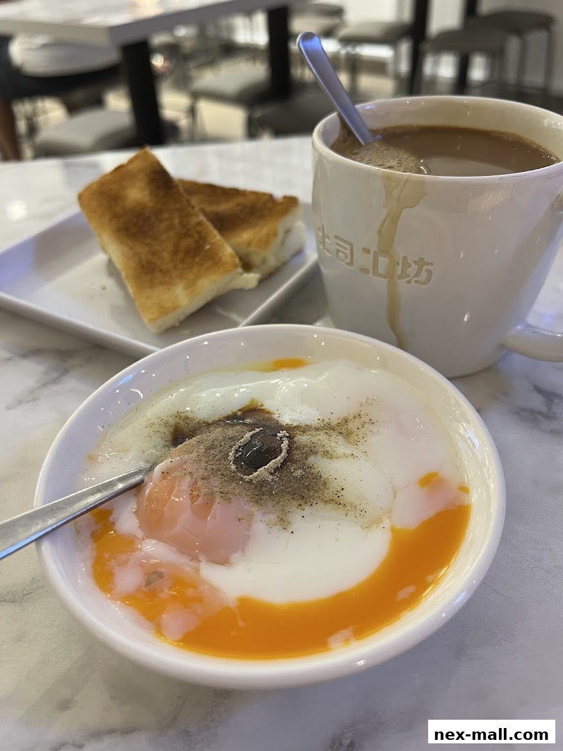 A close-up of a breakfast set with soft-boiled eggs, toast, and coffee.