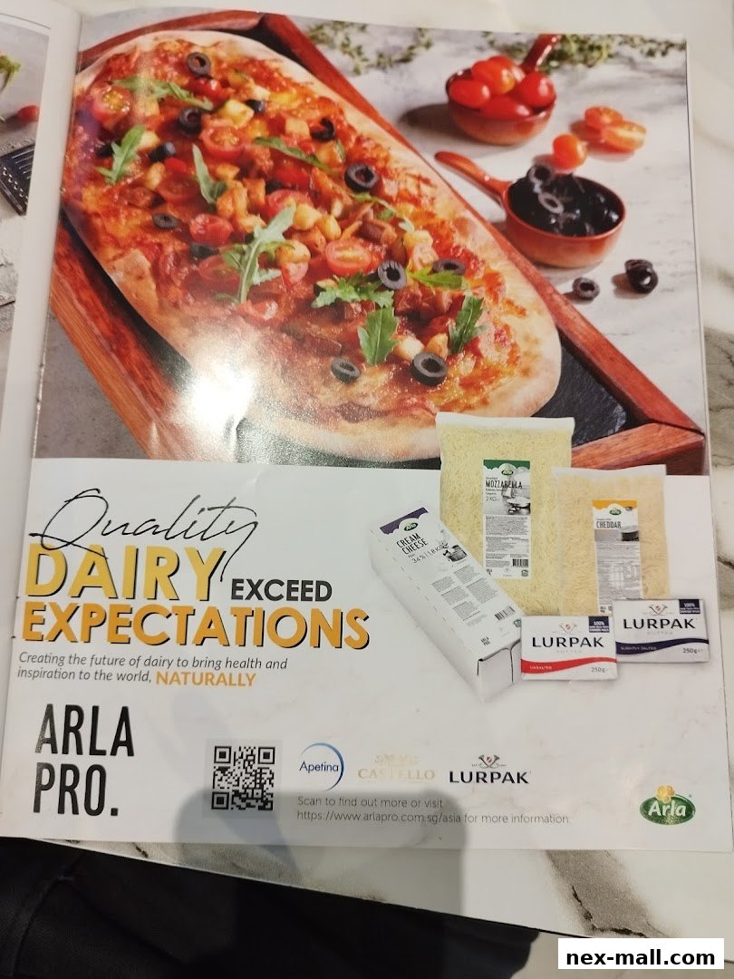 A delicious pizza is shown alongside various dairy products from Arla Pro.