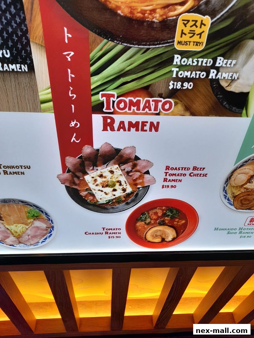 A close-up of a ramen shop menu featuring various tomato-based ramen dishes.