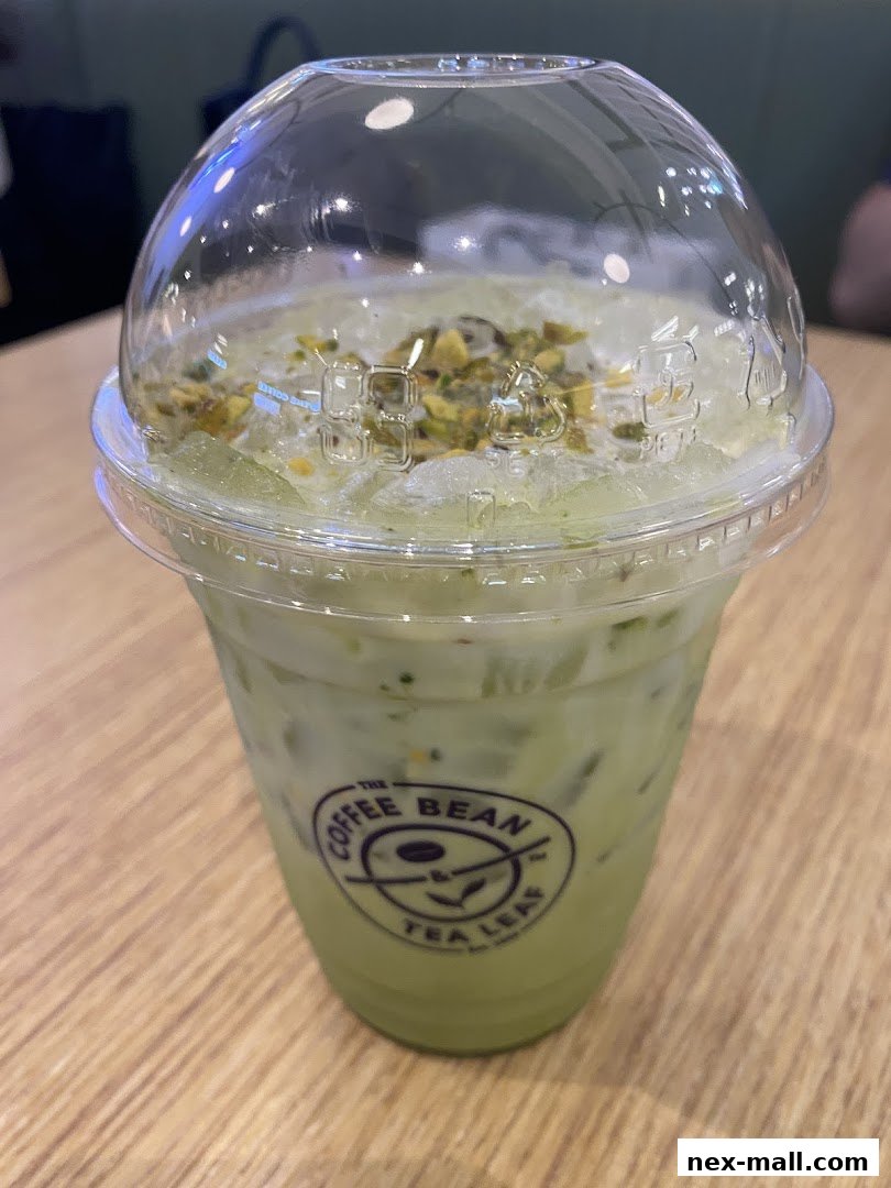 A refreshing iced matcha latte with crushed ice and pistachios from The Coffee Bean & Tea Leaf.