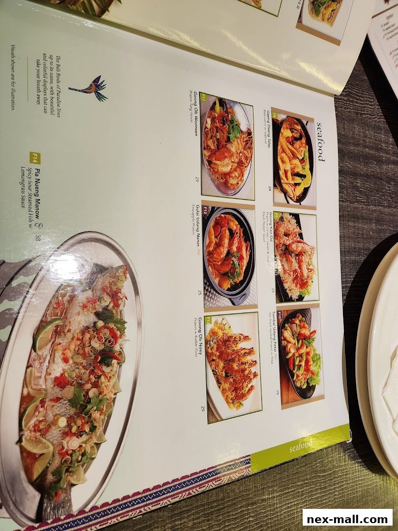 A menu page from Bali Thai NEX featuring seafood dishes with vibrant food photography.