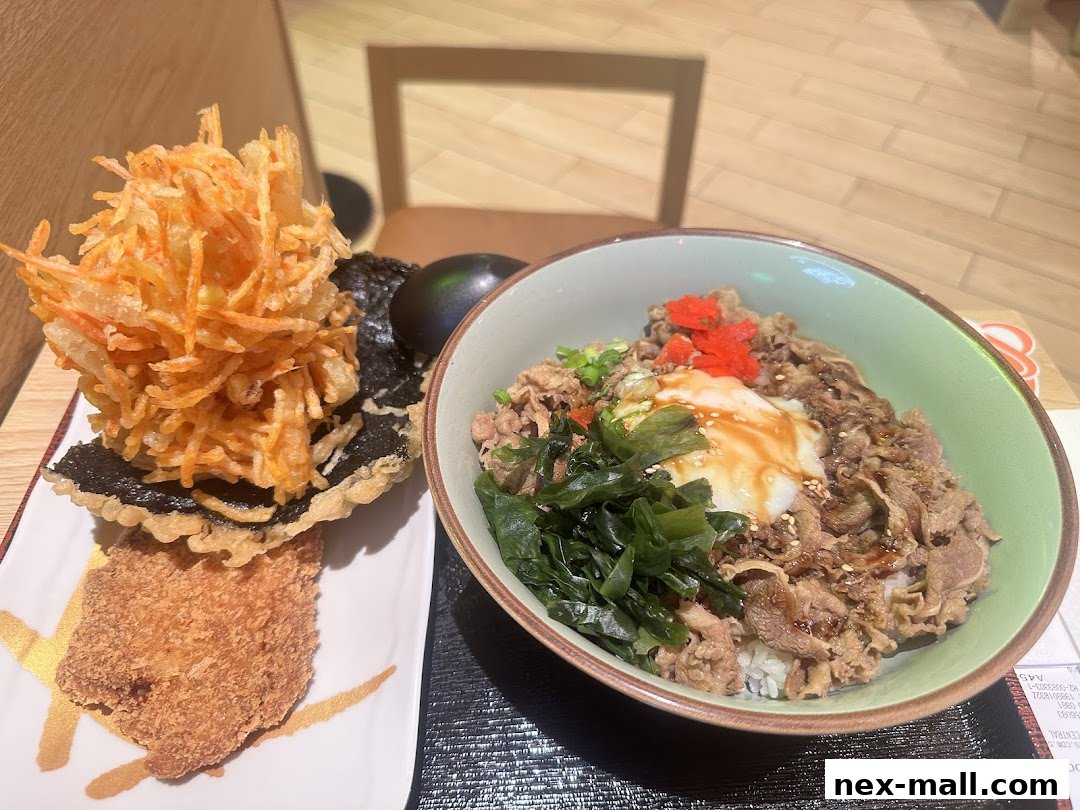 A bowl of beef rice with toppings and a side of fried vegetables and cutlet.