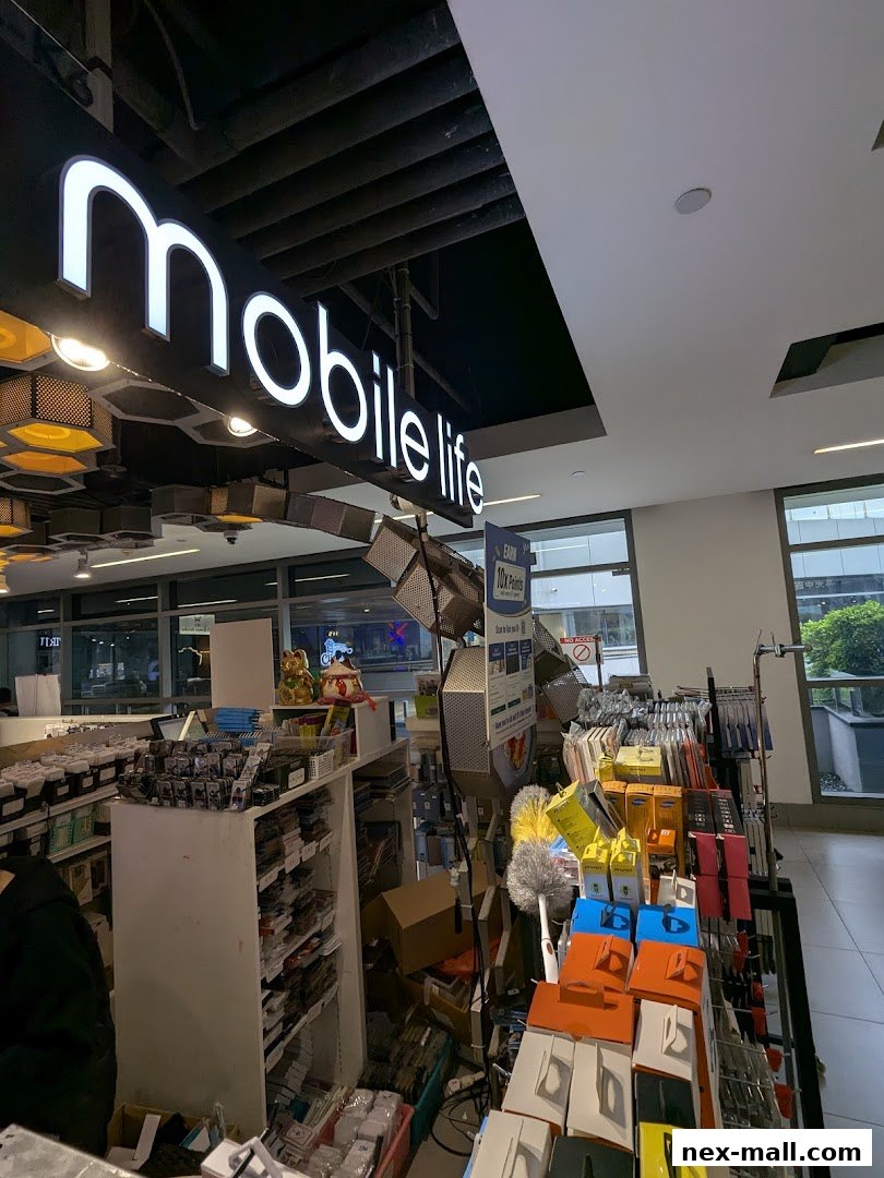 Interior view of a mobile accessories and repair shop with a prominent 'mobile life' sign.