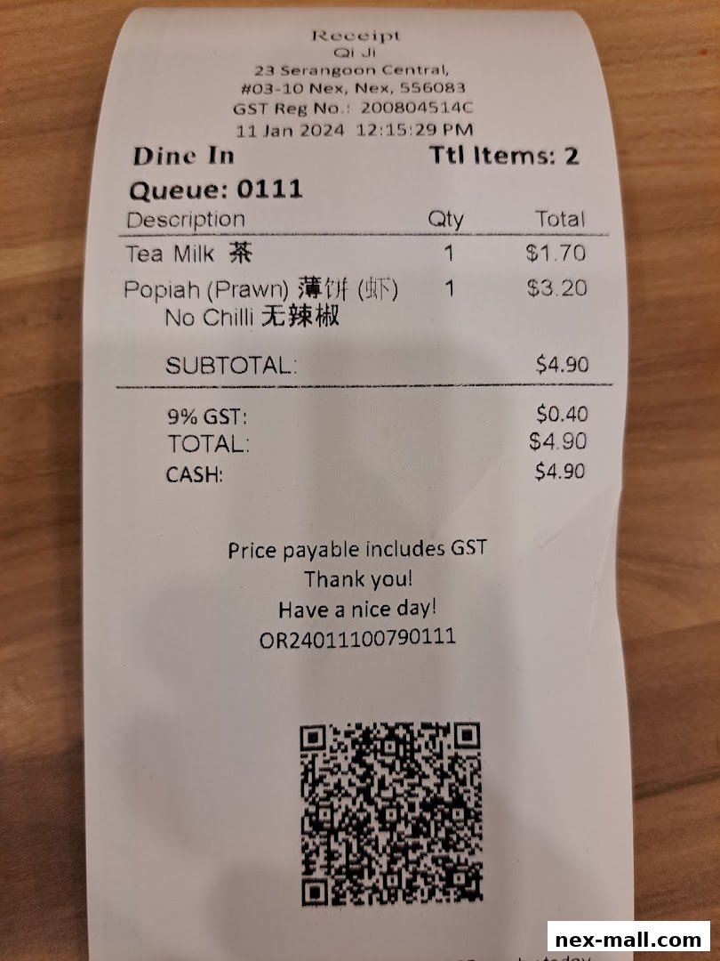 A receipt from Qi Ji showing a purchase of Tea Milk and Popiah.