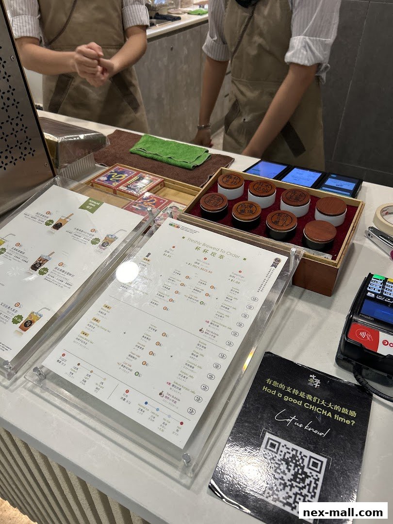 A close-up view of a menu and ordering area at CHICHA San Chen NEX.